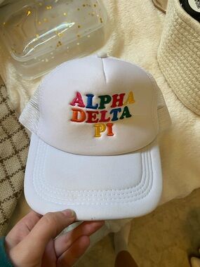 ADPI White Mesh Trucker Hat with Rainbow Embroidery